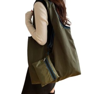 Custom Large Foldable Bag with Zipper Pouch in olive green carried over the shoulder with its zip pouch attached, corporate gift Singapore