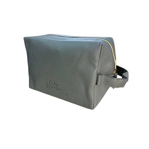 Custom PU Leather Aircon Controller Pouch Angled View Singapore Angled view of custom PU leather aircon controller pouch showing gold zip and side carry handle, Singapore