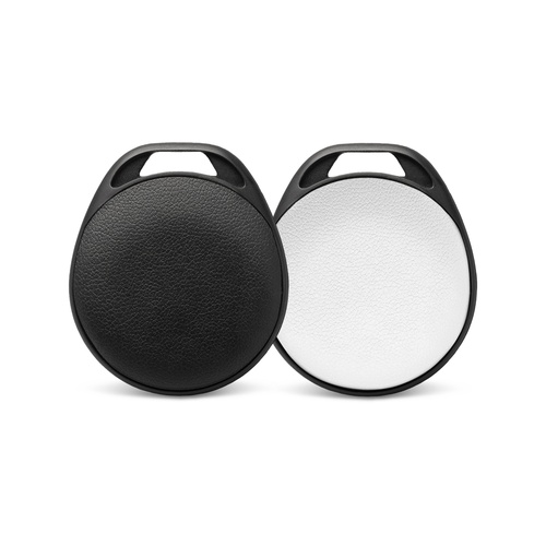 Bluetooth item tracker shown in both finishes, a black disc and a brushed silver disc, each in a black loop housing, Singapore
