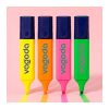 STAEDTLER Highlighter, Textsurfer in 97% Recycled Plastic 12 Four branded highlighters standing upright on a pink background with swatches of ink drawn beneath them, Singapore