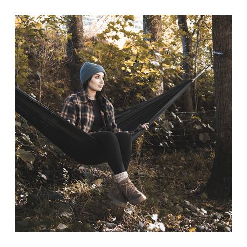 Custom Hammock, Frontier Stratus 210T Nylon for Two 6 A woman sitting in a black camping hammock strung between two trees in autumn woodland, Singapore