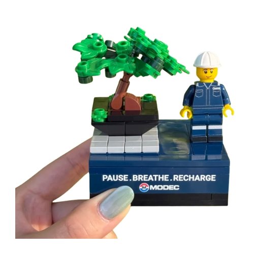Custom brick model of a bonsai with PPE minifigure on a printed wellness base - corporate gift Singapore