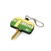 Print mock-up showing a custom shaped moulded PVC key topper fitted over the head of a flat door key with a silver ball chain, Singapore