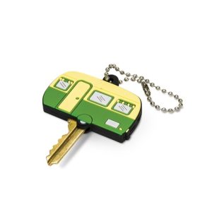 Print mock-up showing a custom shaped moulded PVC key topper fitted over the head of a flat door key with a silver ball chain, Singapore