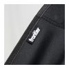 Close view of the stitched seat fabric and woven Frontier logo tab on the folding chair, Singapore