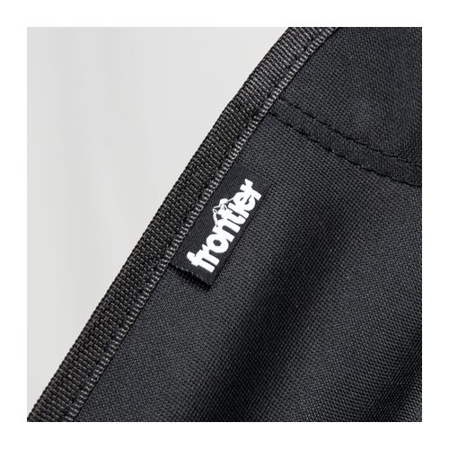 Close view of the stitched seat fabric and woven Frontier logo tab on the folding chair, Singapore