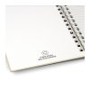 Inside page of the spiral notebook printed with a made from recycled paper mark, Singapore