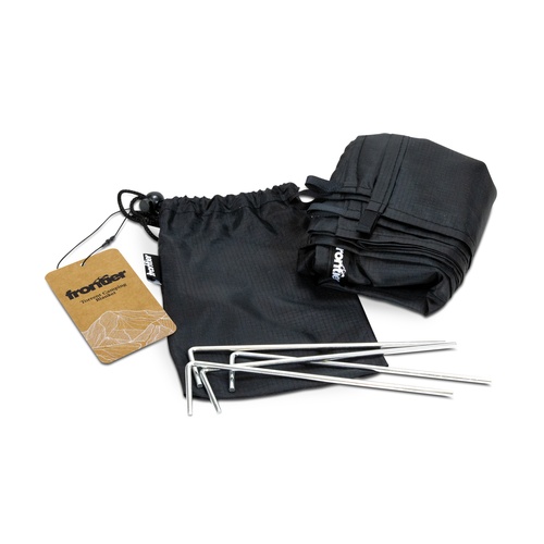 Water resistant camping blanket folded with its drawstring pouch and four metal pegs, Singapore